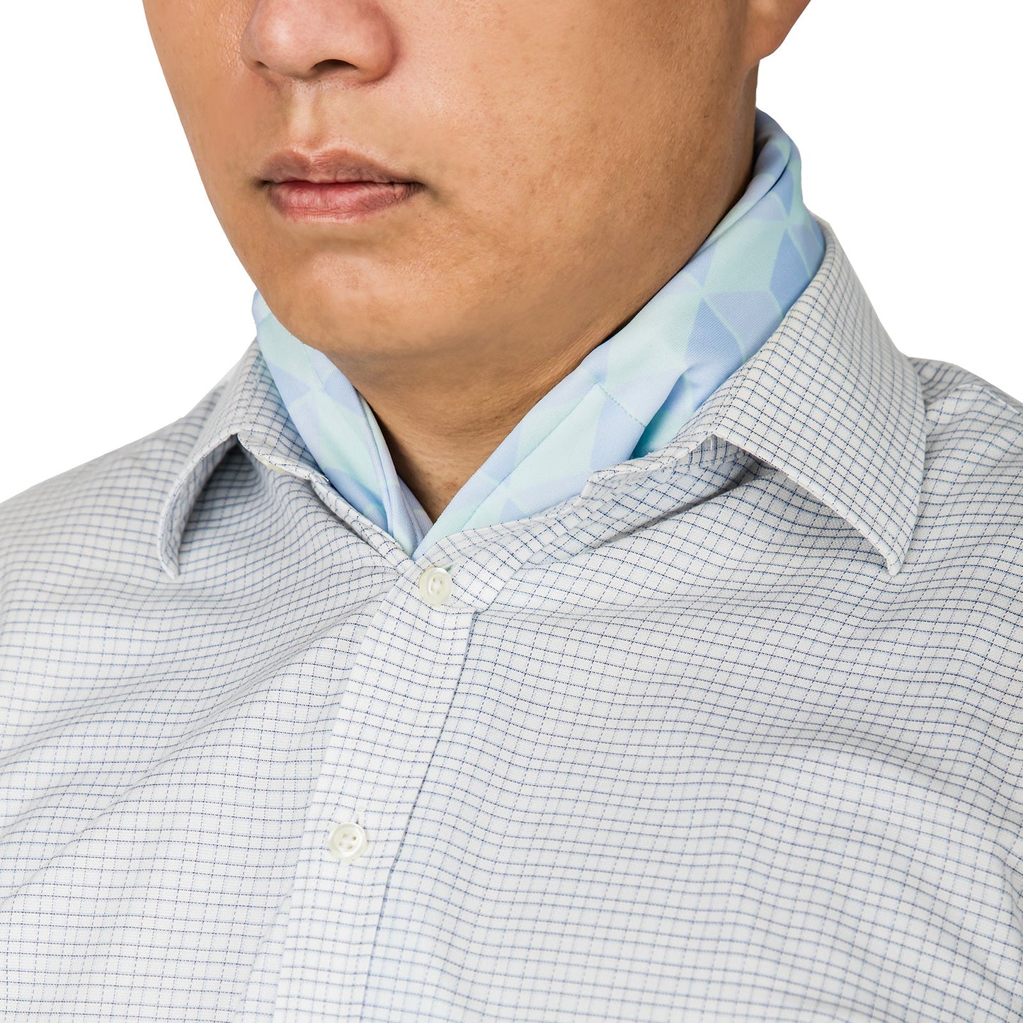 Cooling neck scarf with cubic pattern worn discreetly under a dress shirt for hot-weather comfort