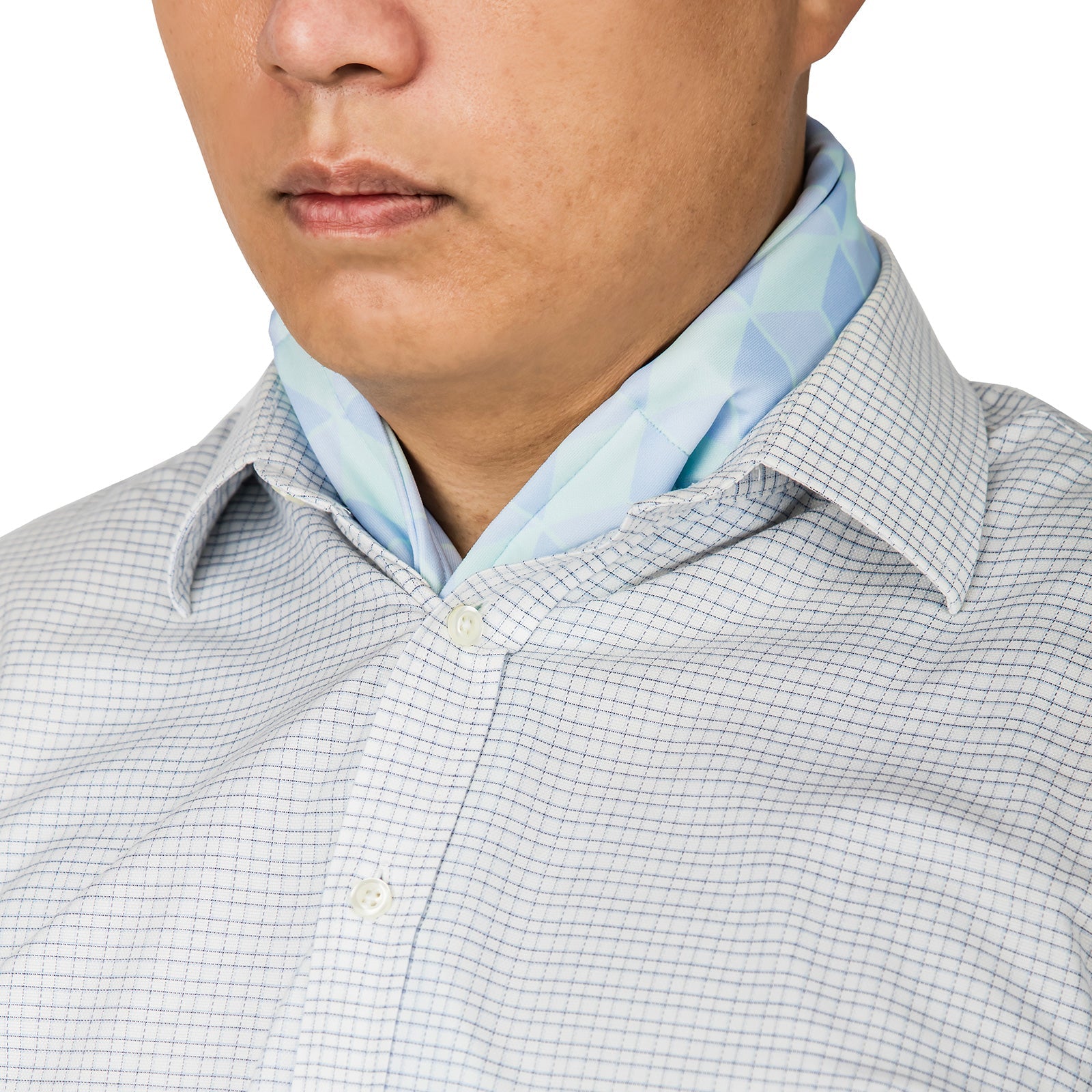 Cooling neck scarf with cubic pattern worn discreetly under a dress shirt for hot-weather comfort
