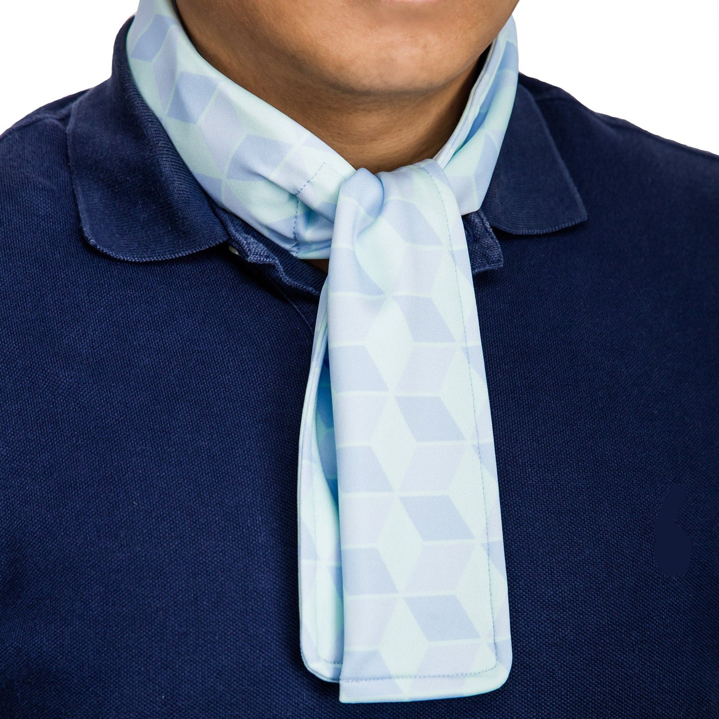 Cooling neck scarf with cubic pattern worn over a polo shirt for hot-weather casual comfort