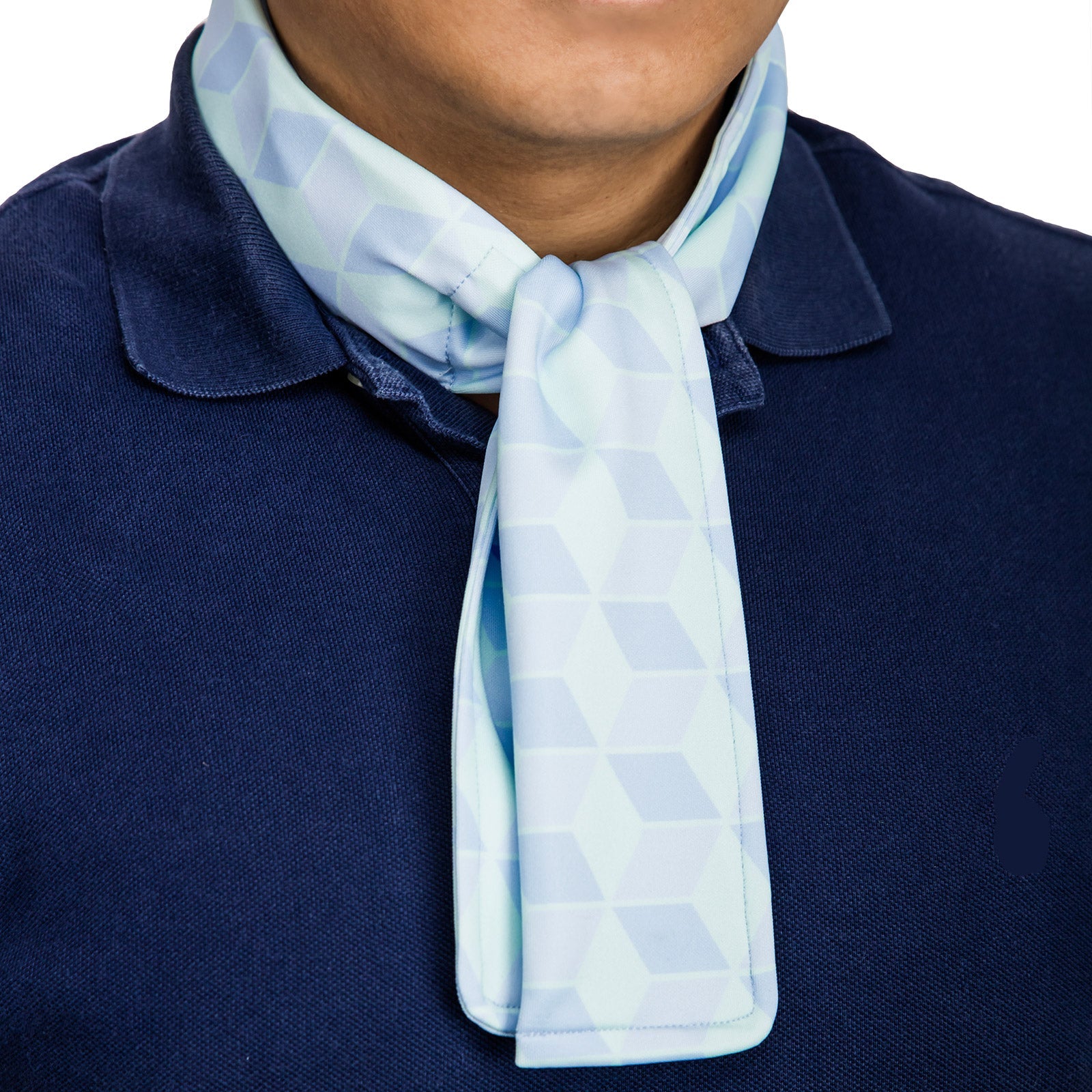 Cooling neck scarf with cubic pattern worn over a polo shirt for hot-weather casual comfort